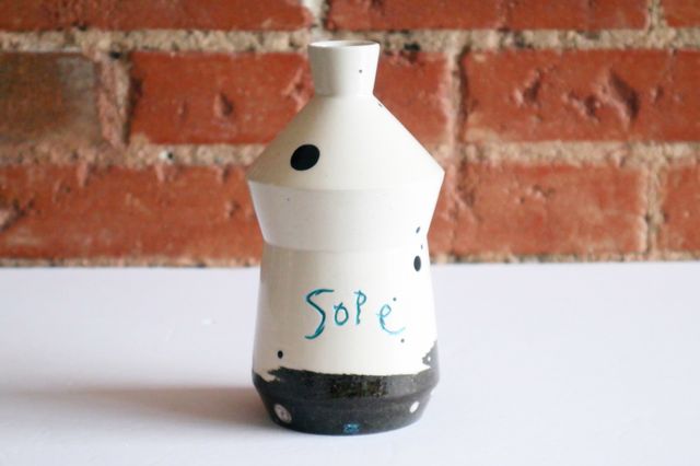 The shape is angular, pushing out from the base gently – then back in towards a high waste, out again to the shoulder, and into a narrow neck. My stamp and the word sope are inlaid with teal.
