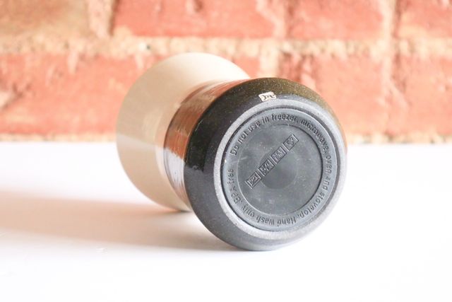 The bottom, with a shallow clay foot ring that hides a non-slip rubber sticker.