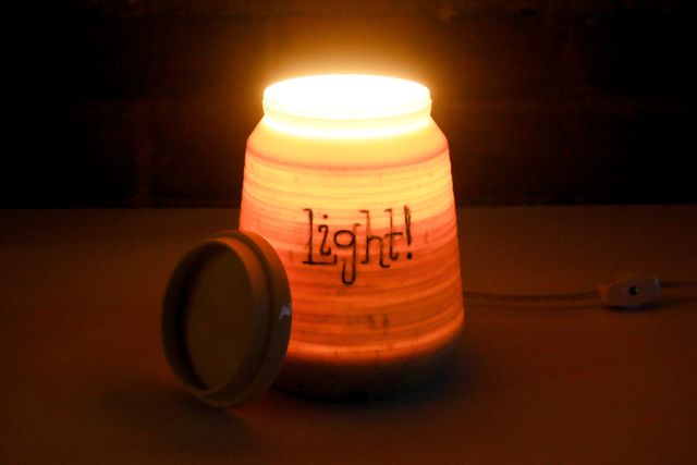 With the lid off, light pours from the top of the jar.
