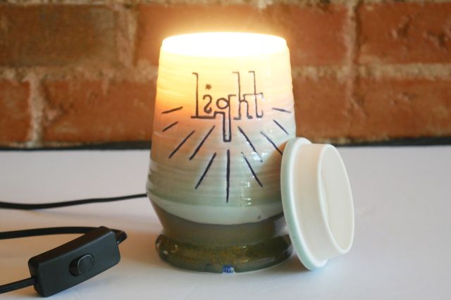 With the lid off, light pours from the top of the jar.
