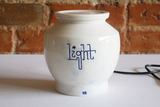 With the light off, the jar is white with subtle splashes of blue.

