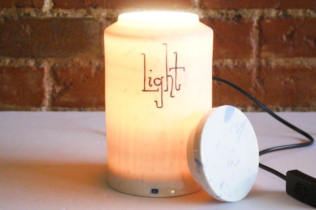 With the lid removed, light pours from the top of the jar.
