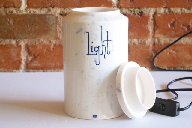 The lid is flat on top, and slightly angled out on the sides, with a locating flange helping it sit securely in the jar.
