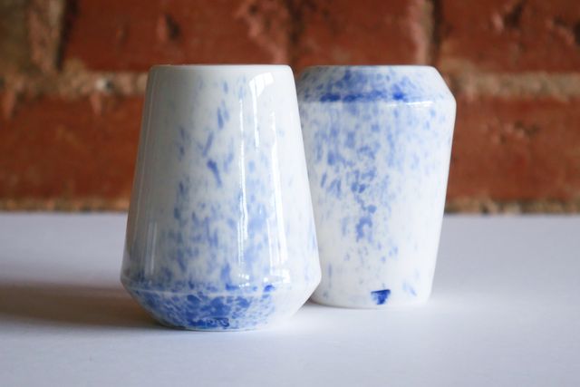The forms are angular - flaring wide at one end, and then sloping in gently towards the other end. My stamp is inlaid blue near the base.