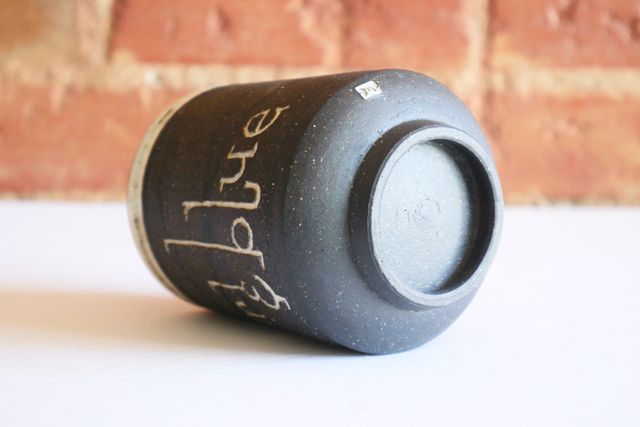 The underside is gently rounded with a foot ring that slopes in slightly towards the table - holding the tumbler about a quarter inch off the surface. My small m stamp is also inlaid with white on the rounded base.
