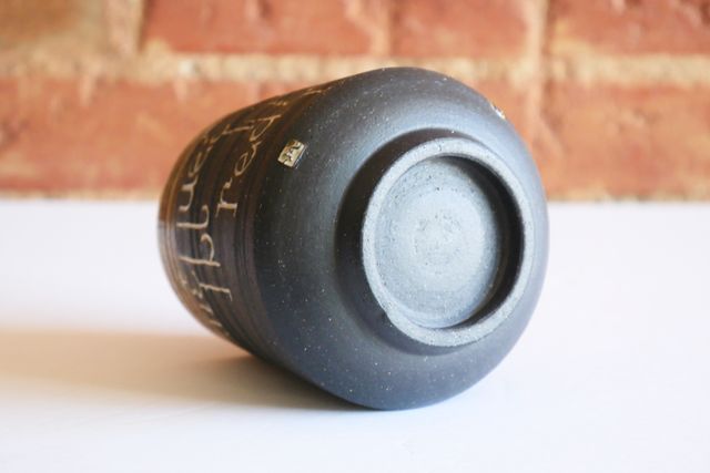 The underside is gently rounded with a foot ring that slopes in slightly towards the table - holding the tumbler about a quarter inch off the surface. My small m stamp is also inlaid with white on the rounded base.

