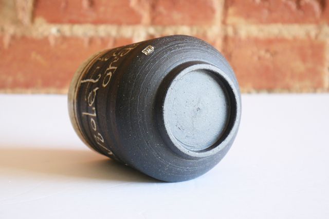 The underside is gently rounded with a foot ring that slopes in slightly towards the table - holding the tumbler about a quarter inch off the surface. My small m stamp is also inlaid with white on the rounded base.
