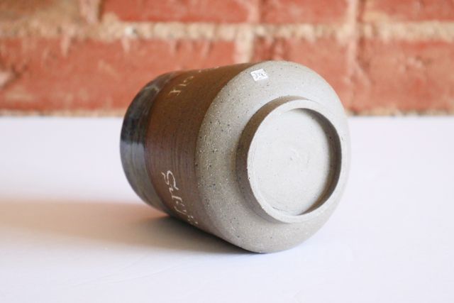 The underside is gently rounded with a foot ring that slopes in slightly towards the table - holding the tumbler about a quarter inch off the surface. My small m stamp is also inlaid with white on the rounded base.
