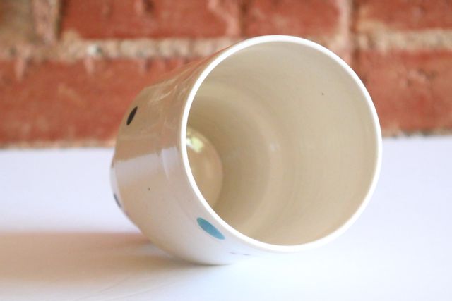 The inside is also white, and the entire piece has a glossy finish.
