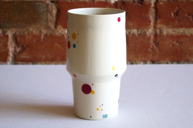 There are a number of colorful polka-dot bubbles - teal, yellow, orange, red, maroon, navy, and black - floating across the surface. My small m stamp at the base also has a teal fill.